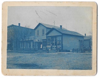 Item #67080 Photograph. "Joe Taylor Meat Market and Home 1889, 1895 in Versailles, Ohio."